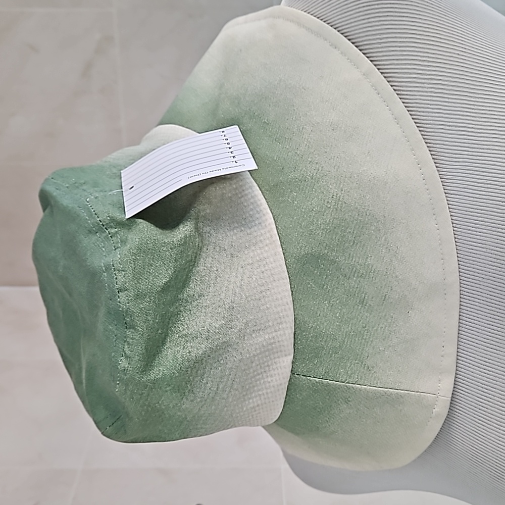 Christian Siriano sage umbra bucket hat.